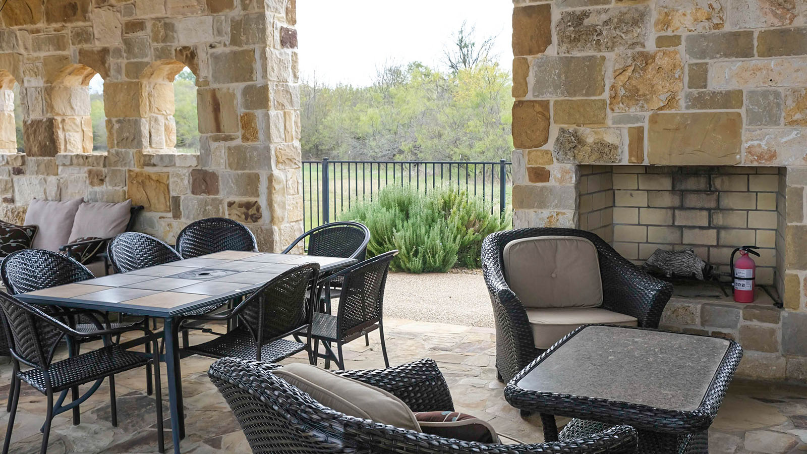 The clubhouse with seating areas and a fire place.