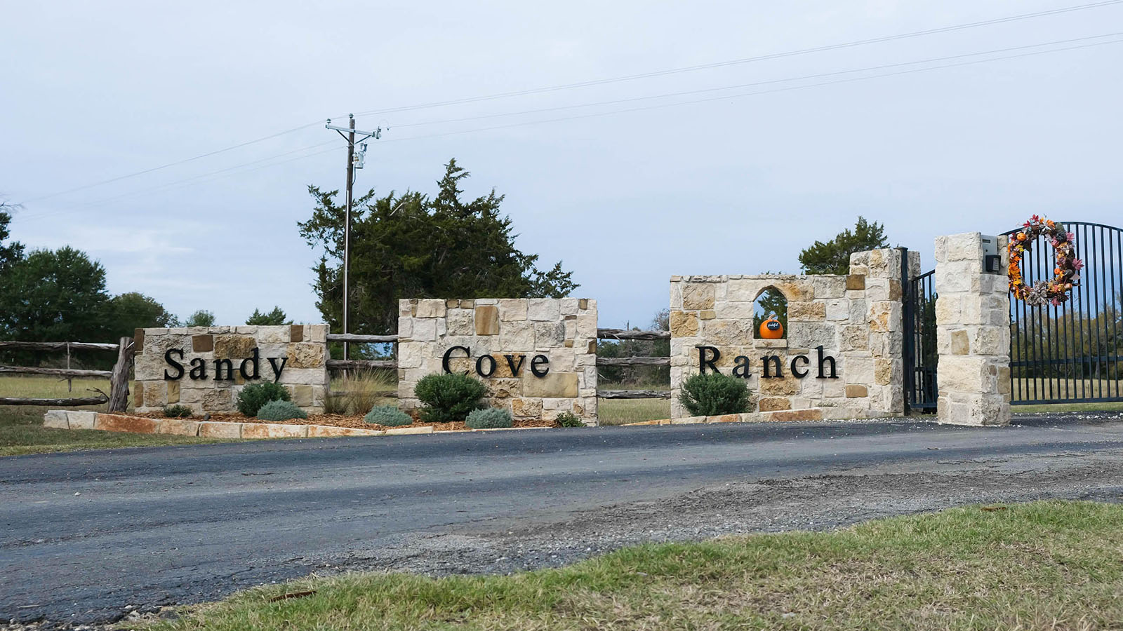The gated front entrance to Sandy Cove Ranch.