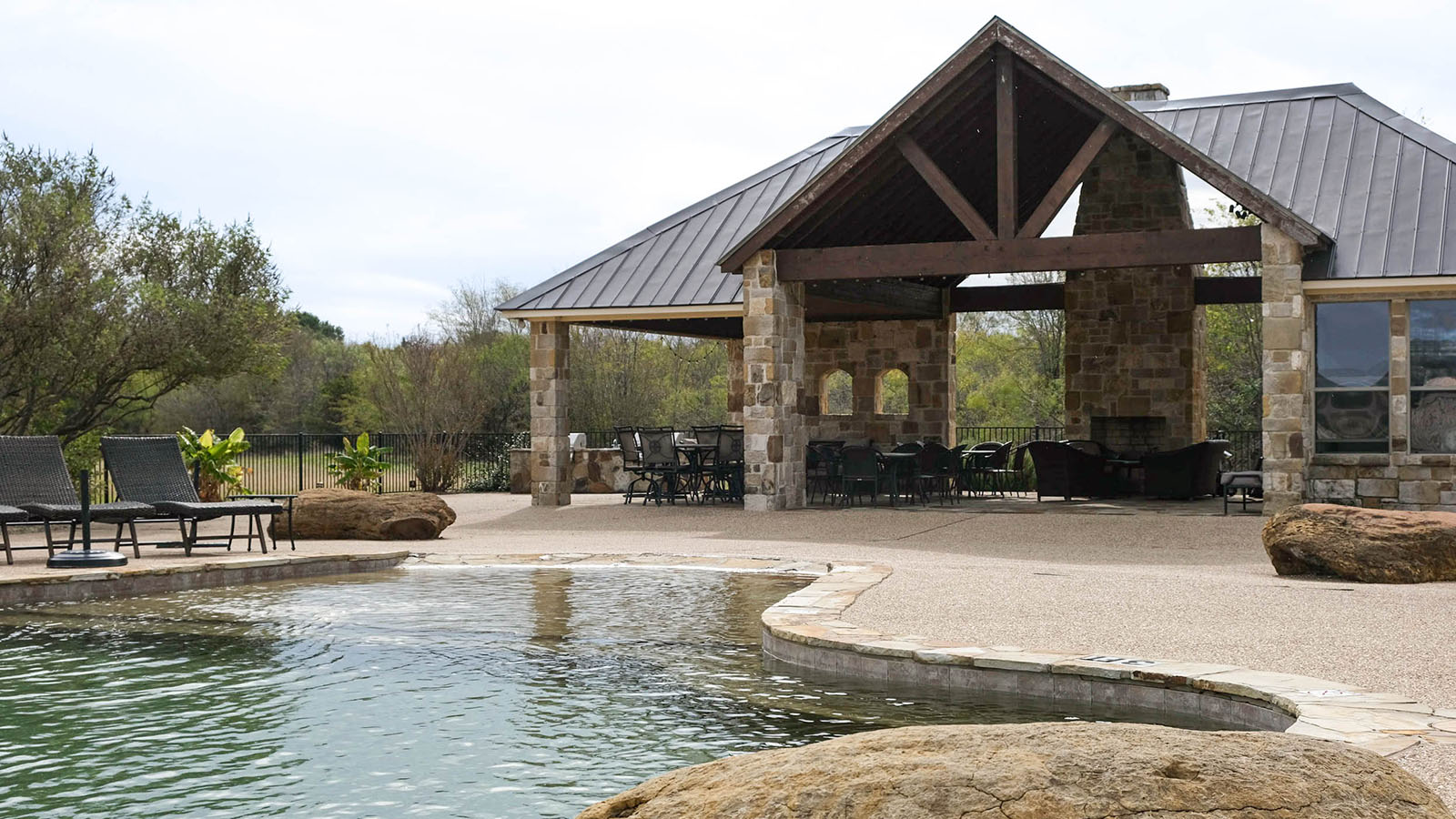 Pool and community area A view of the community pool and pool house and club house areas including the grills.